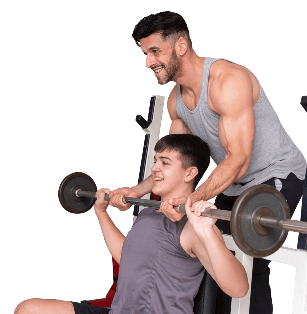 Two individuals engaging in personal training by lifting a barbell in a gym.