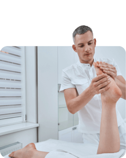 A man receiving podiatry services with foot massage from a therapist.