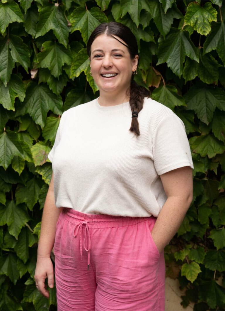 Lily Vesty, A woman wearing pink pants and a white t-shirt